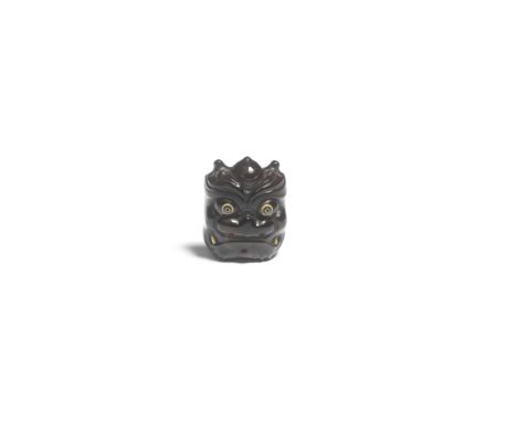 A TORTOISESHELL NETSUKE OF AN ONI (DEMON) MASKBy Komin, Edo period (1615-1868) or Meiji era (1868-1912), 19th centuryThe oni 