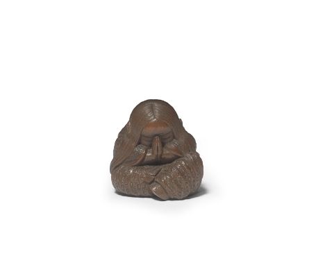 A WOOD NETSUKE OF A SLEEPING SHOJO (DRUNKEN SPRITE)By Ikkan (Nagoya, 1817-1893), Edo period (1615-1868), mid/late 19th centur