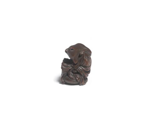 A WOOD NETSUKE OF A FOX WITH A DRUM (KITSUNE TADANOBU)By Ittan, Nagoya, Edo period (1615-1868), early/mid-19th centuryThe fox