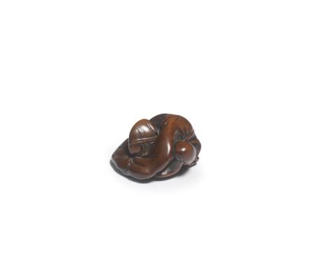 A WOOD NETSUKE OF A SLEEPING COURTIEREdo period (1615-1868), early/mid-19th centurySeated with one knee upright, folded over 