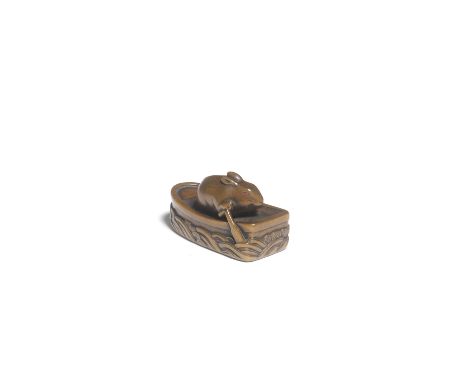 A WOOD NETSUKE OF A RABBIT ON A BOATBy Ryukosai Jugyoku, Edo, Edo period (1615-1868), 19th centuryThe rabbit rowing the boat 