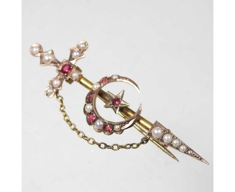 A 15 carat gold, ruby and split pearl brooch, of sword and crescent design, with a pin back, 4g, 7cm long