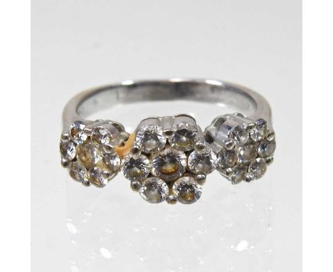 An 18 carat white gold illusion set diamond triple cluster ring, 6.2g, size Q, boxed