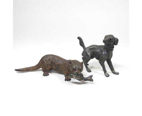 An Austrian cold painted bronze model of an otter, holding a fish, 18cm long, together with a novelty pepper, in the form of 