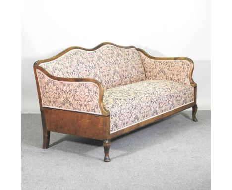 A 1920's continental floral upholstered drop end sofa, with a shaped back, on cabriole legs180d x 74d x 89h cm