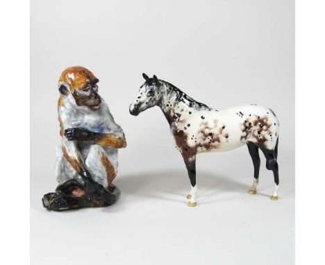 A Meissen style continental porcelain model of a monkey, late 19th/early 20th century, shown seated, blue hatched mark to bas