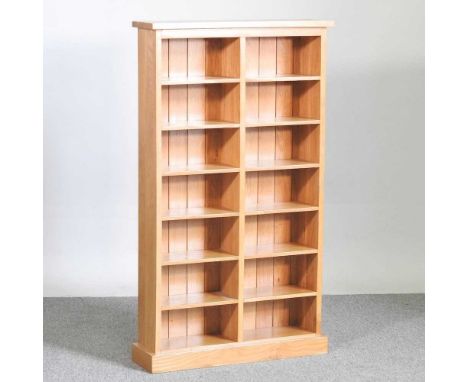 A modern light oak bookcase66w x 18d x 115h cm