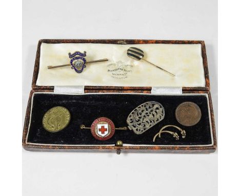 An early 20th century enamelled tie pin, together with a Women's British Legion badge and costume jewellery