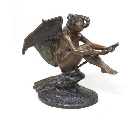 An Art Nouveau bronze inkwell, in the form of a fairy, shown seated on a broomstick, 12cm highOverall condition looks to be c