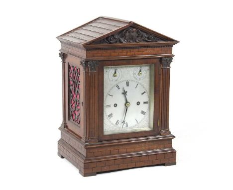 A 19th century bracket clock, the architectural case, flanked by pilasters and carved with bricks, with a silvered dial, havi