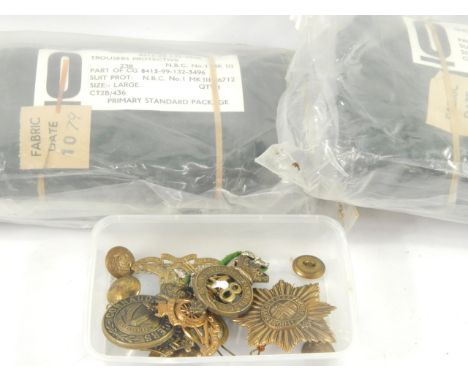 A small collection of military brass cap badges, including Artillery, Army Cyclists Corp, Connaught Rangers and 48th Northamp