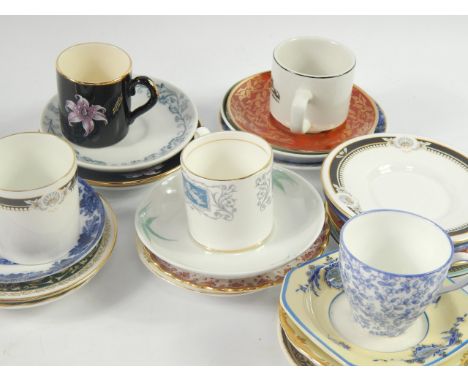 A collection of coffee cups and saucers, of various manufacturers.