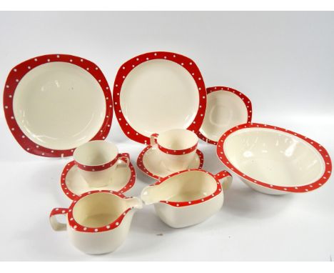 A Midwinter pottery part dinner and tea service, decorated in a red polka dot pattern, comprising meat platter, vegetable tur