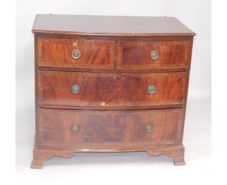 A Georgian style mahogany bow front chest of drawers, with two short and two long drawers, raised on ogee bracket feet, 92cm 