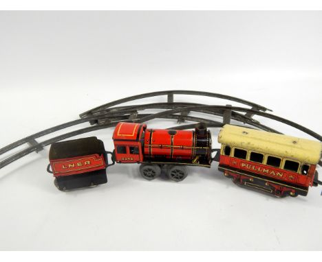 A tin plate clockwork express train set, comprising engine, LNER tender and Pulman coach with track (box AF)
