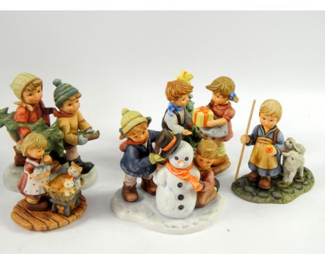 Berta Hummel figures, comprising New Arrivals, Crowning Touch, O Come All Ye Faithful, A Present for You and Tree Trimming Ti