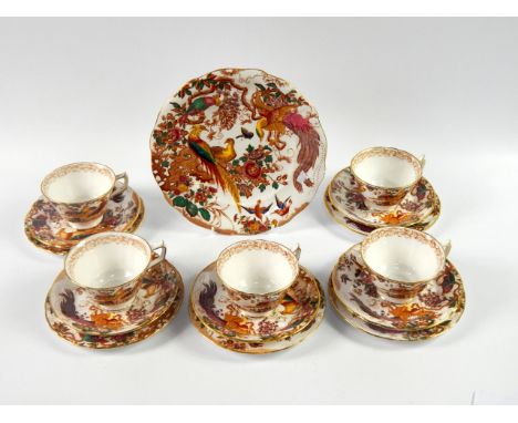 A Royal Crown Derby porcelain tea service, decorated in the Olde Avesbury pattern, comprising bread plate, cream jug, sugar b