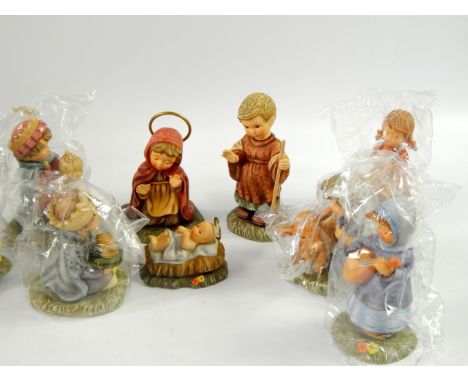 A Berta Hummel Nativity set, comprising Jesus, Mary, Joseph, Angel standing, Angel kneeling, camel, sleeping shepherd, peasan