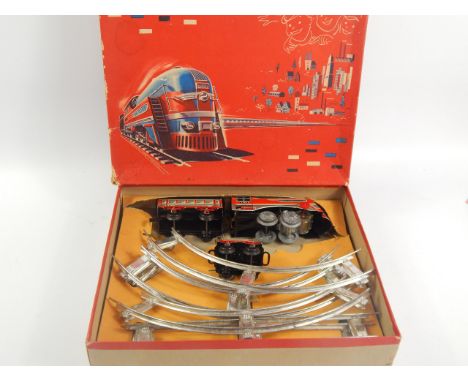 A Distler battery operated train set, the engine named The Flyer, sold with tender, carriage, some track, in original box wit