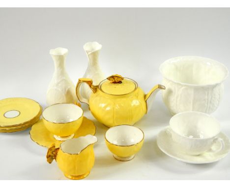 An Aynsley porcelain yellow ground tete-a-tete tea service, with butterfly handles, pattern B1399, comprising teapot, cream j