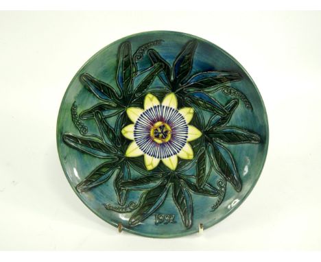 A Moorcroft pottery plate, decorated with convulvulus, year plate 1992, limited edition 276/500, second series, first edition