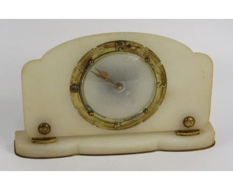 An Art Deco brass and alabaster mantel clock. chapter ring bearing Arabic numerals at quarters, later Quartz movement, 28cm l