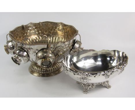 A silver plated Monteith, with lion's head and ring handles, semi fluted and chased with floral swags, and six cups, together