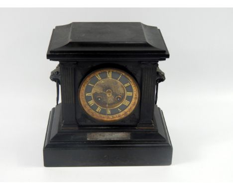 A Victorian slate mantel clock, of architectural form, brass dial, black enamelled chapter ring bearing Roman numerals, eight