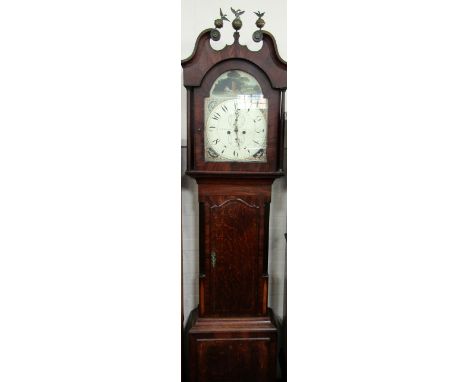 A George III oak and mahogany longcase clock, the hood with swan neck pediment and three eagle and globe finials, break arch 