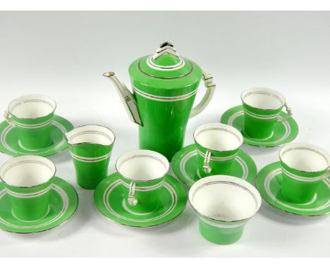 A Royal Albert Art Deco porcelain part coffee service, decorated with silver lustre bands against a green ground, comprising 