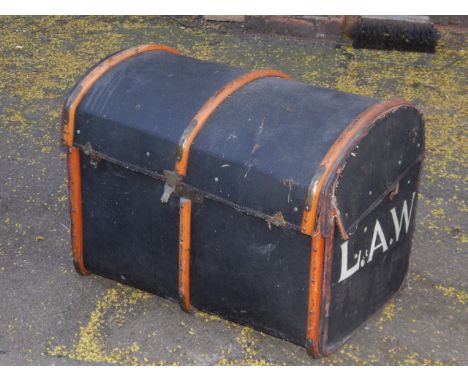 A domed canvas cabin trunk, bamboo bound with leather carrying handles, 76cm x 51cm x 59cm.