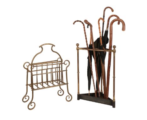 A VICTORIAN BRASS STICK STAND of triangular section with cast iron drip tray, 61.5cm high x 42.5cm wide x 23cm deep; together