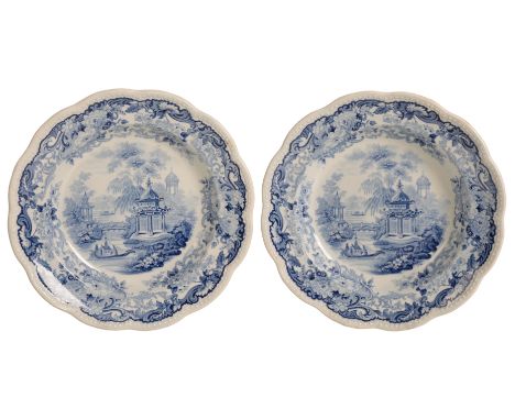 A PAIR OF WEDGWOOD BLUE AND WHITE PLATES mid-20th century, with foliated and beaded edges, decorated with riverside scenes wi
