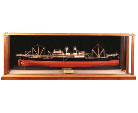 A HALF-HULL BUILDER'S WOODEN MODEL OF CARGO STEAMER TABARISTAN circa 1907, in original display case with mirrored panels, int
