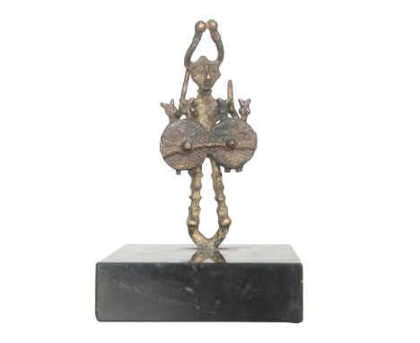 A SARDINIAN NURAGIC FIGURE OF A WARRIOR modelled with four arms holding twin shields, bronze, 9cm high, mounted on a later re