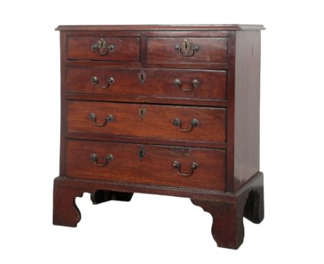 A GEORGE III MAHOGANY SMALL CHEST OF DRAWERS with two short and three long graduated drawers, on tall shaped bracket feet, 78
