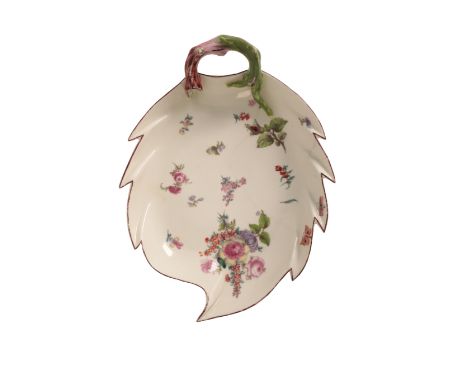 A CHELSEA PORCELAIN LEAF SHAPED DISH mid-18th century, decorated with scattered flower sprigs and a bouquet of flowers, with 