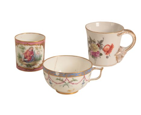 THREE CONTINENTAL PORCELAIN CUPS 18th century, two of Sèvres manufacture, the first decorated with seated courtier against a 