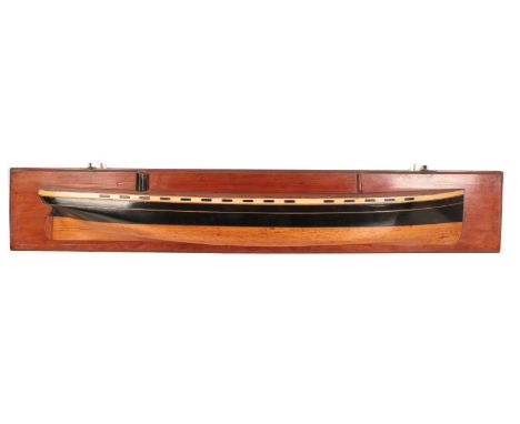 A HALF-HULL MODEL OF A STEAM SHIP mid-20th century, mounted on an oak board, 22.5cm high x 131cm longProvenance: The Egerton 