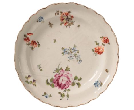 A DERBY PORCELAIN STAND circa 1760, with gilt scallop edge and decorated with scattered flower sprigs, 16cm diameterProvenanc