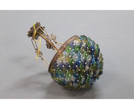 A small ceiling hanging light fitting, decorated with green, blue, clear and yellow glass petals with pearl centres.  Length 