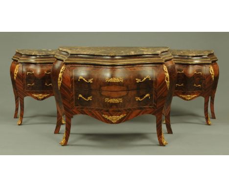 A Louis XV style marble topped commode and pair of cabinets to match, walnut and kingwood banded, each fitted with two drawer