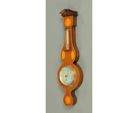 An Edwardian style mahogany cased aneroid barometer, with alcohol thermometer.  Height 69 cm. CONDITION REPORT: The barometer