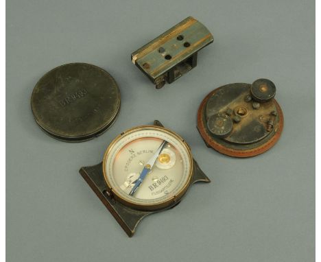 A Paul Goerz artillery compass, Second World War, silvered dial marked "BR9493" with protected cover bracket and mount.  Diam