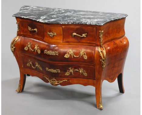 A marble topped commode chest, with variegated green marble top and two short and four long drawers with gold coloured handle
