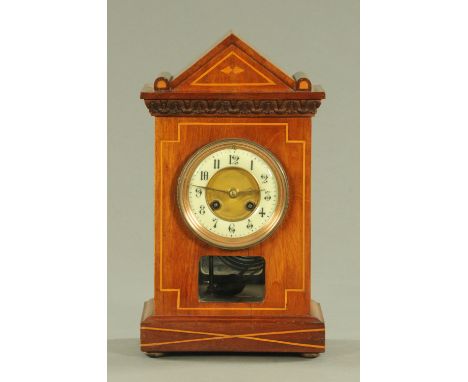 An Edwardian inlaid mahogany mantle clock, with eight day movement striking on a gong, 35.5 cm high.
