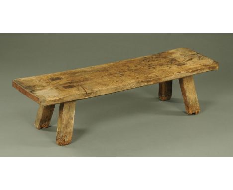 A 19th century oak pig bench, the rectangular top with rounded corners and applied wrought iron ends all upon short rectangul