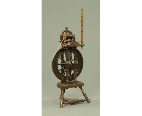 A 19th century oak spinning wheel, of good colour and patination.   CONDITION REPORT: The wool winder housing is broken and m