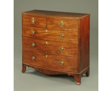 An early 19th century mahogany bowfront chest of drawers, the top with crossbanded edge with boxwood and ebony checkered stri
