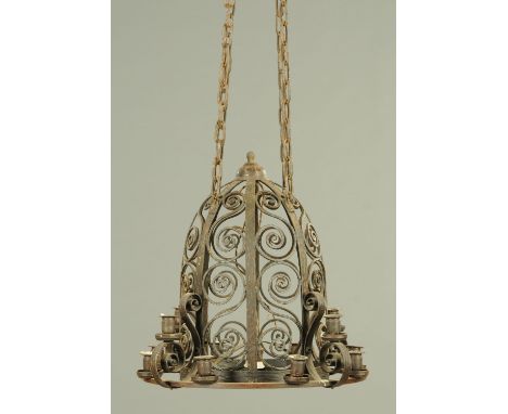 A wrought iron domed hanging light fitting, with candle sconces. Maximum width +/- 58 cm, height 50 cm. CONDITION REPORT: A f